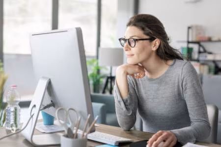 Woman Working at Desk - Getting Things Done Methodology