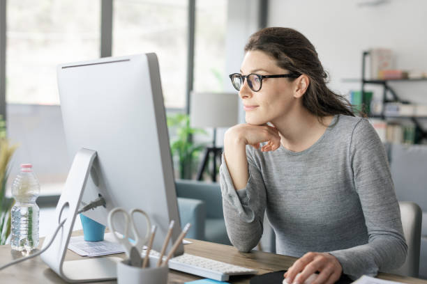 Woman Working at Desk - Getting Things Done Methodology